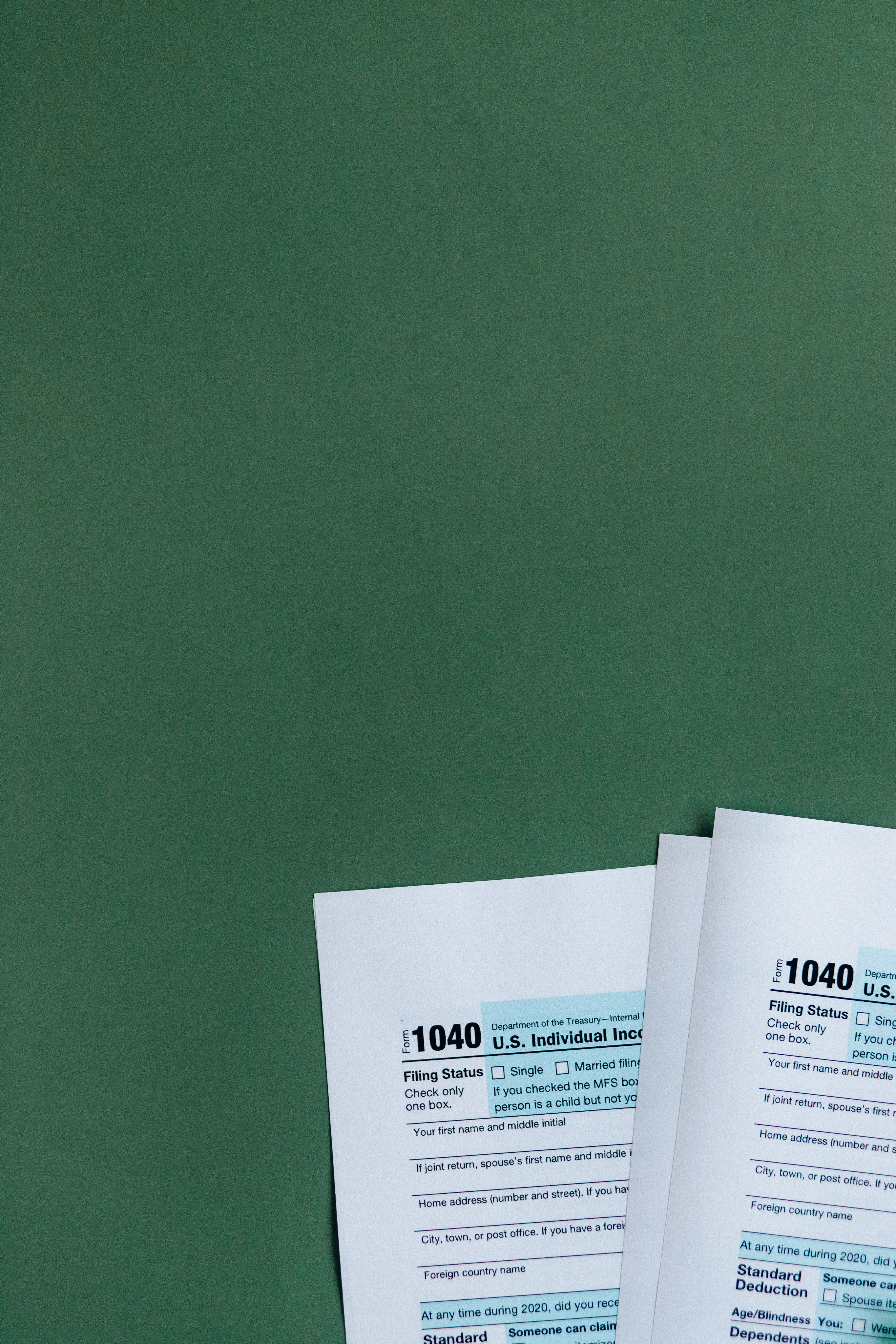 United States tax forms on a green surface